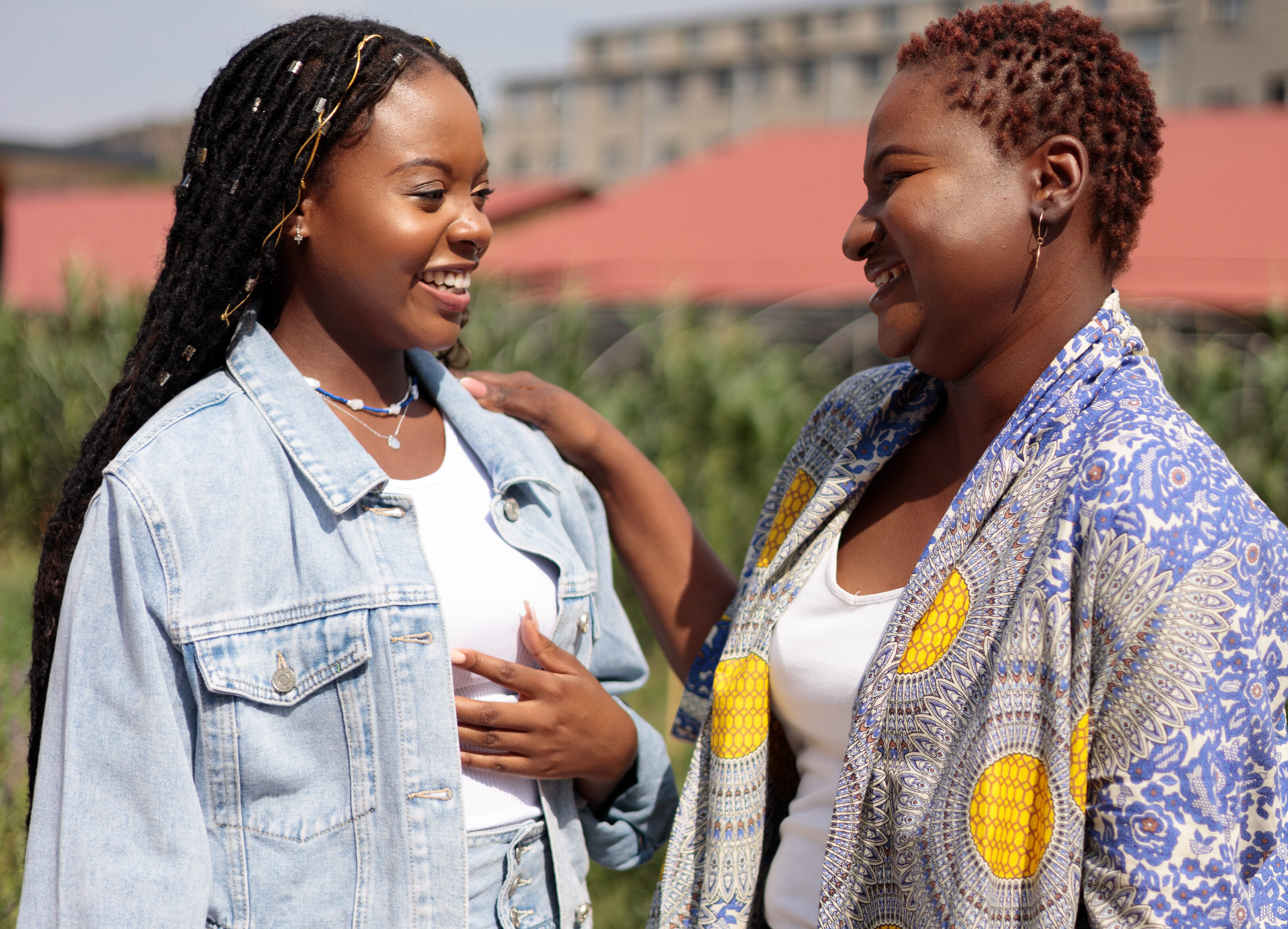 Two women smiling at each other
