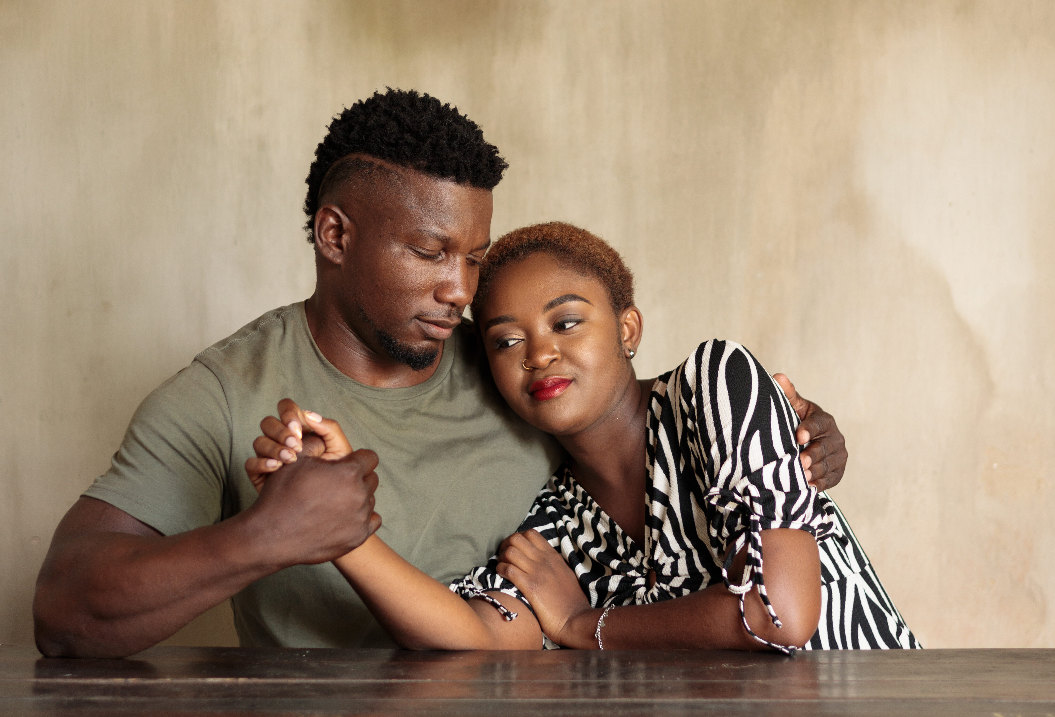 Male and female couple cuddling and holding hands